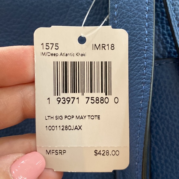 Blue leather Coach tote with brown signature strip on top. - Picture 7 of 7